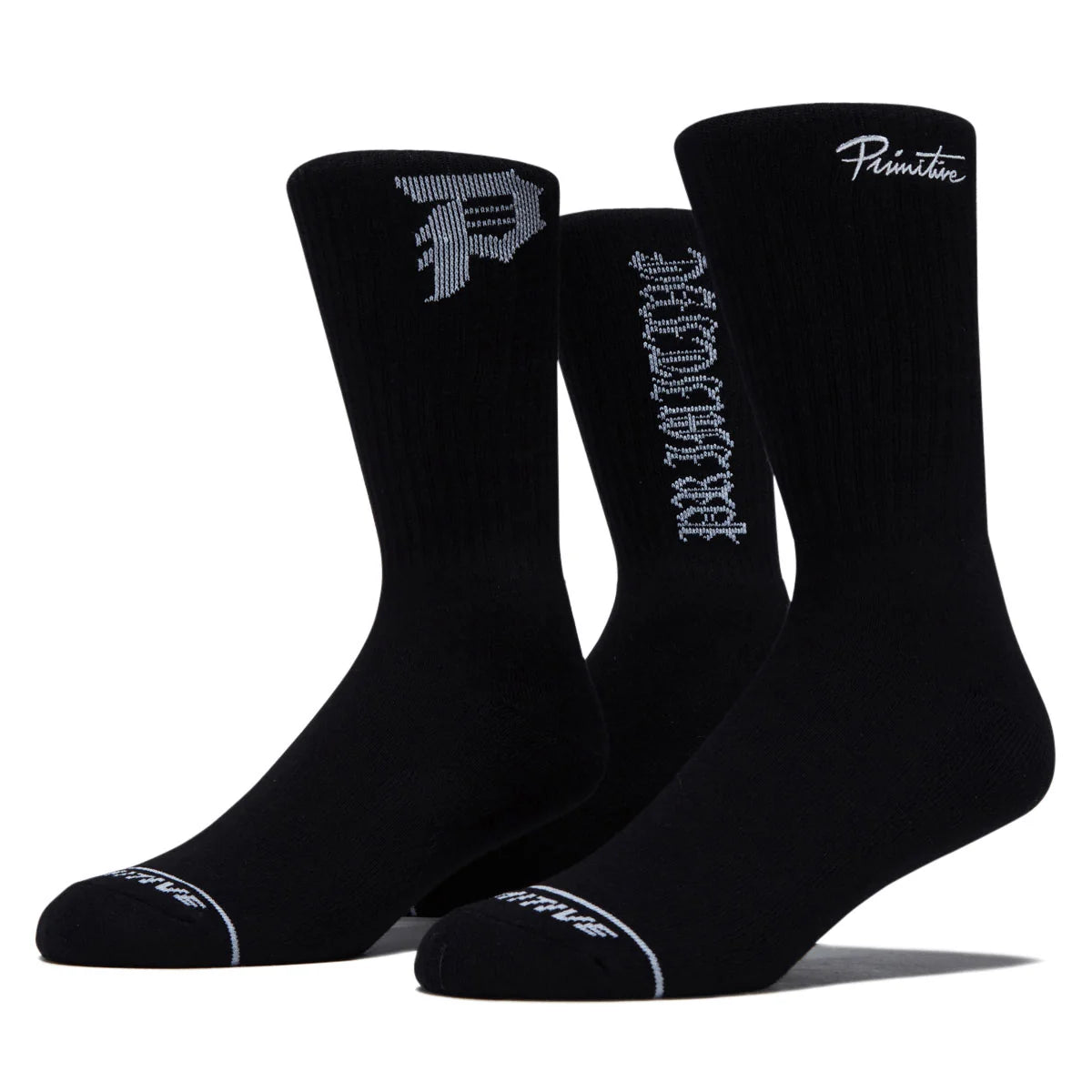 Three black crew socks with white and gray branding details, including the Primitiva logo and 'Primitivo' text, displayed against a clean white background.