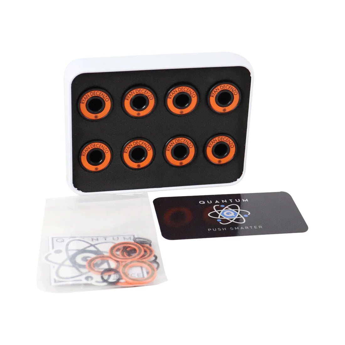 Set of orange and black circular components on a black tray with Quantum branding.