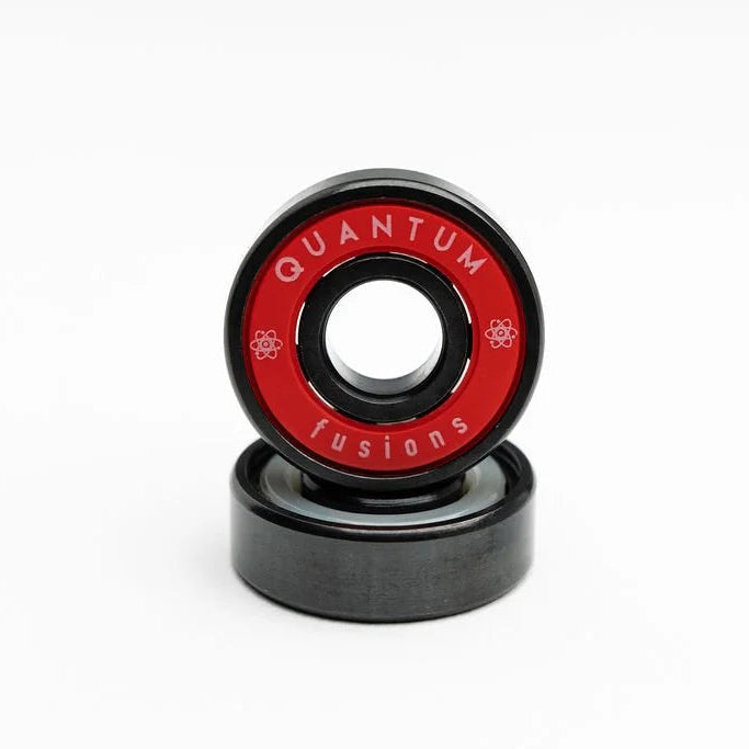 Two skateboard wheels with 'Quantum Fusions' branding on a white background