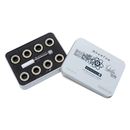 Set of skateboard bearings and tools in a Quantum box on a white background