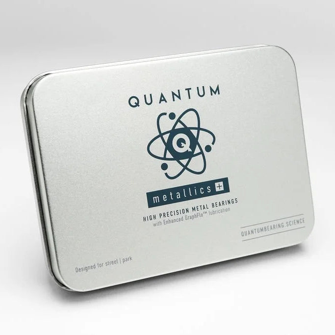 Metal tin packaging with 'Quantum Metallics' branding on a white background