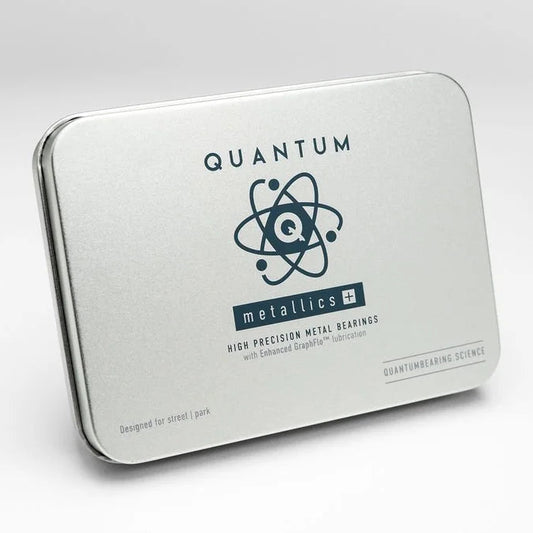 Metal tin packaging with 'Quantum Metallics' branding on a white background