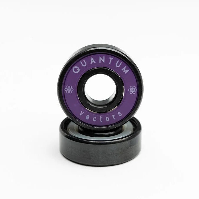 Two black and purple skateboard bearings with 'Quantum Vectors' branding on a white background.