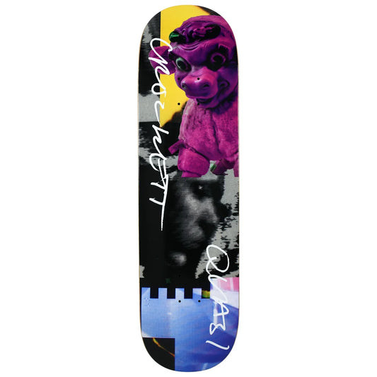 A skateboard deck featuring a colorful graphic design with a purple monster, a black-and-white face, a yellow shape, and a blue castle motif, with the brand name 'quasi' printed in white script.