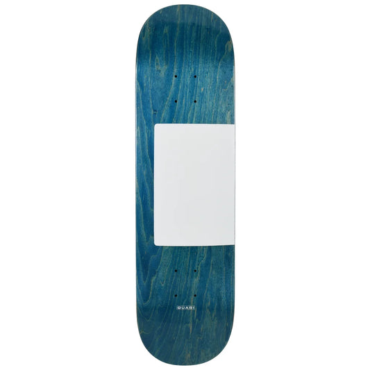 A skateboard deck with a blue and teal wood-grain finish, featuring a blank white square in the center and the brand name 'quasi' printed near the bottom.