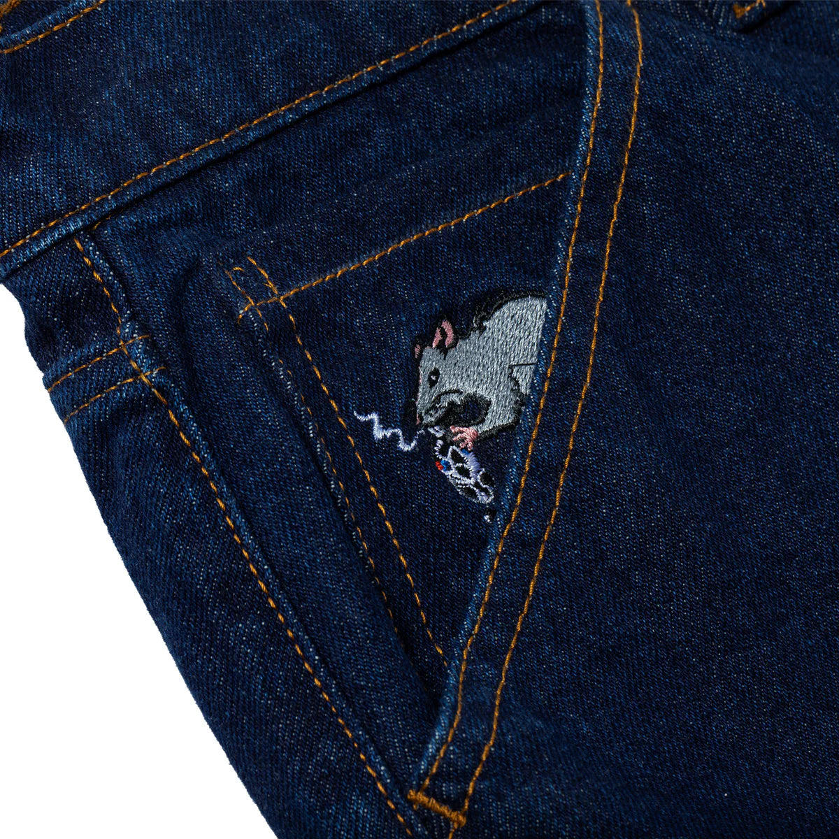 Embroidered rat design on a blue denim fabric