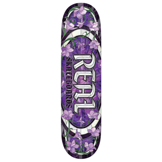 Skateboard deck with purple floral design and 'Real' branding on a white background