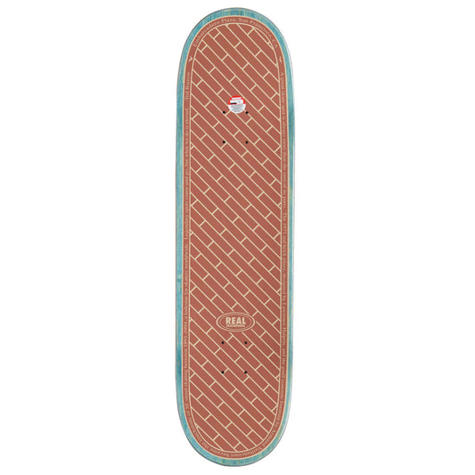 A skateboard deck shown from a top-down view on a plain white background. The deck features a terracotta red brick-patterned grip tape with a light blue painted edge and a visible 'REAL' brand logo near the tail.