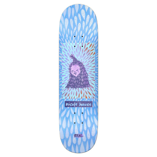 Skateboard deck with a colorful design featuring a face and the brand 'Real' on a white background.