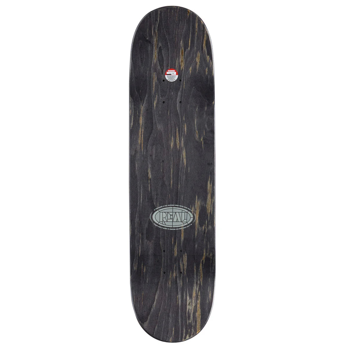 A skateboard deck shown from the underside, featuring a dark black wood grain pattern with natural brown and beige streaks. The deck has a silver oval logo in the center reading 'real' and a small red and white sticker near the nose.