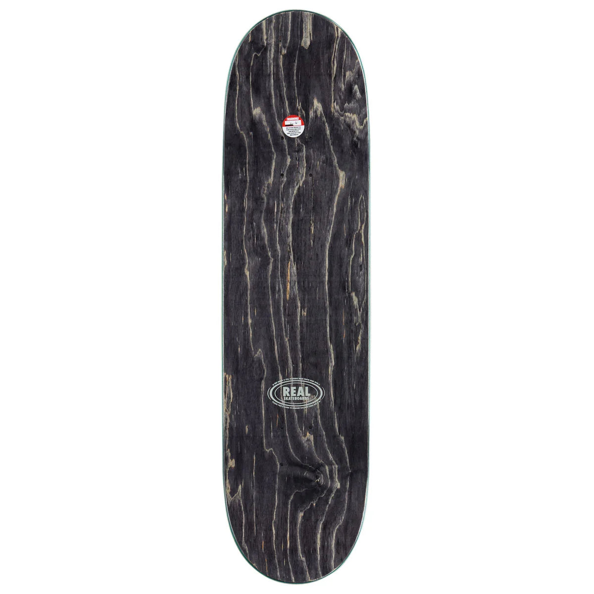 A skateboard deck with a dark, weathered black wood grain finish, featuring a circular 'REAL' brand logo near the center and a small red and white logo near the nose.