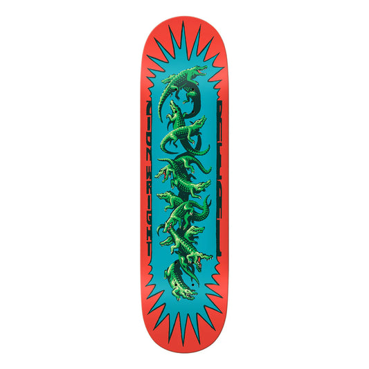 Skateboard deck with green lizard design on a blue and red background