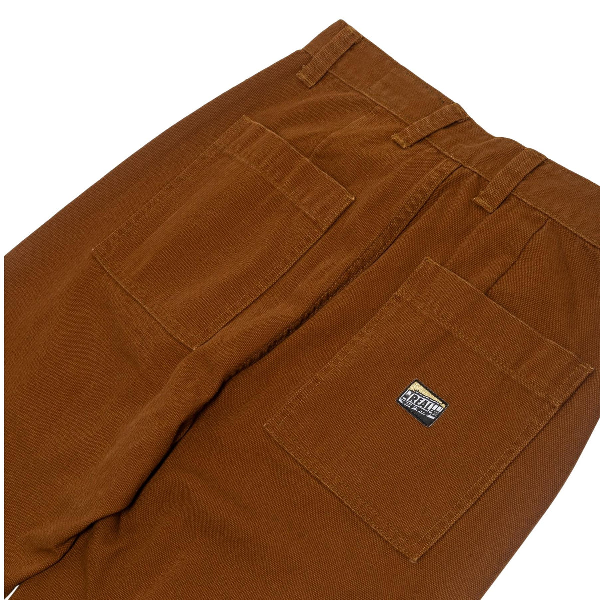 Brown pants with a brand label on a white background