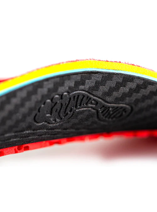 Close-up of a shoe sole with a brand logo on a white background