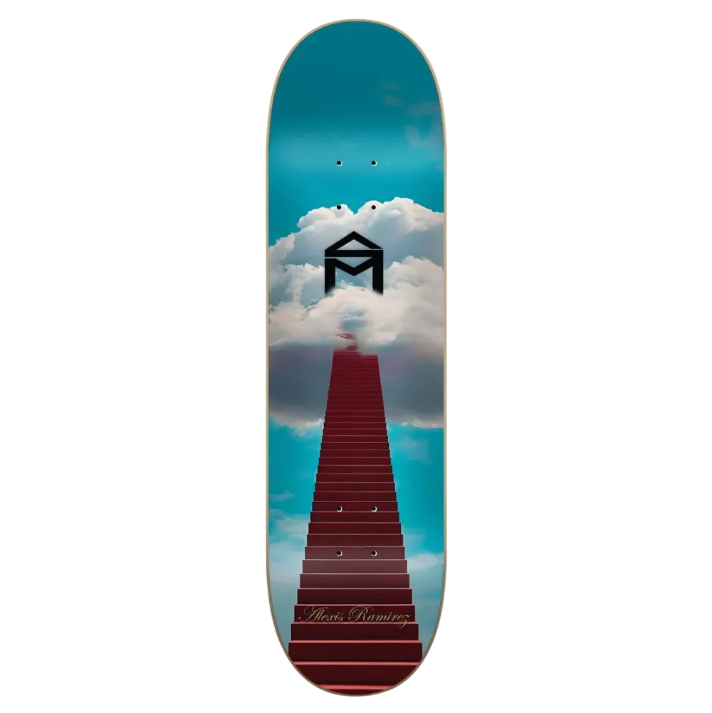 A skateboard deck featuring a graphic design of a red staircase leading up to a black house-shaped roof against a bright blue sky with white clouds. The brand name 'Maison Manning' is printed in gold script near the bottom.