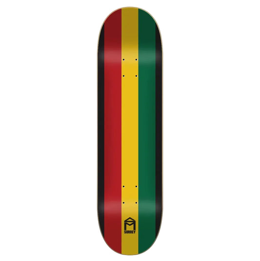 A skateboard deck shown vertically against a light gray background, featuring the Rastafarian flag colors of red, yellow, green, and black in vertical stripes, with a black logo at the bottom.