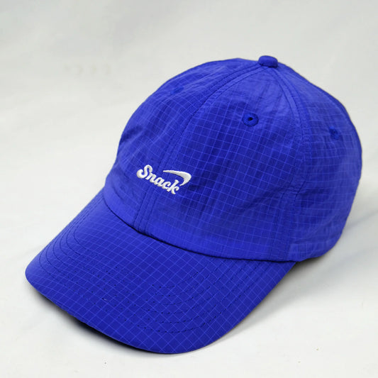 Blue cap with a brand logo on a light gray background
