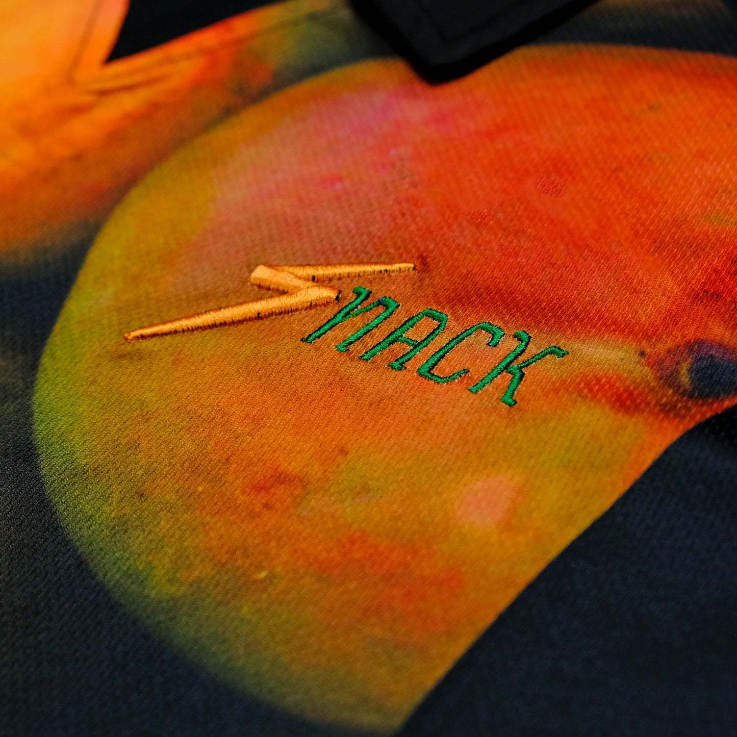 Colorful fabric with 'Zack' embroidered on it