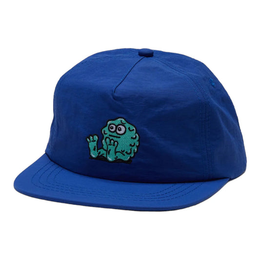 Blue cap with a green monster design on a white background