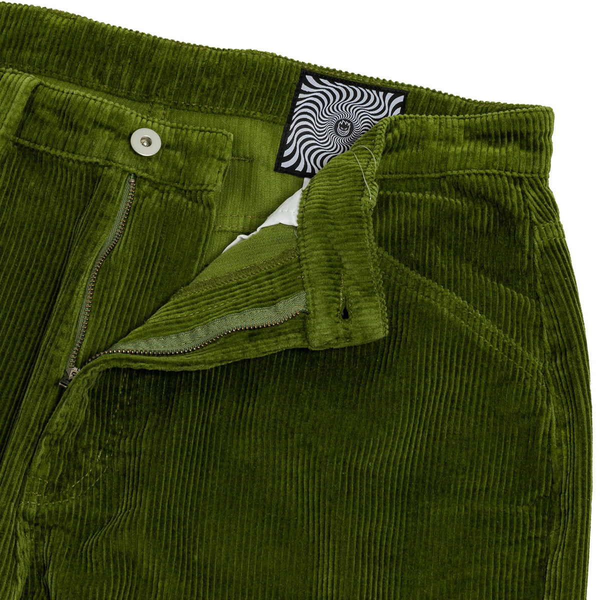 Green corduroy pants with a patterned label on a white background