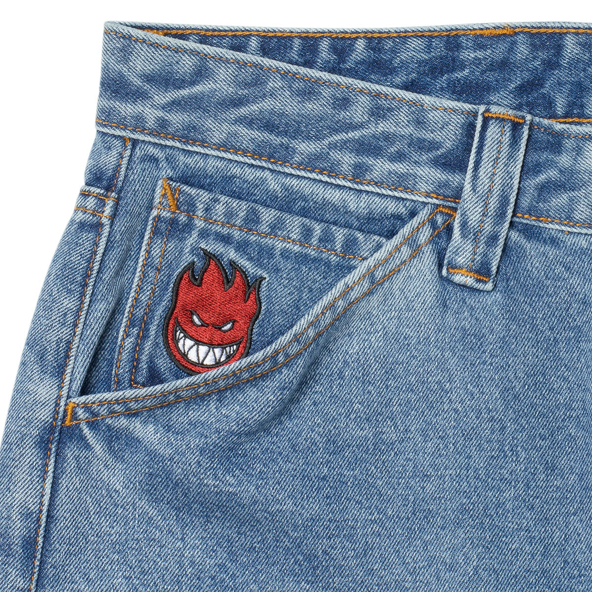 Embroidered design on a blue denim pocket
