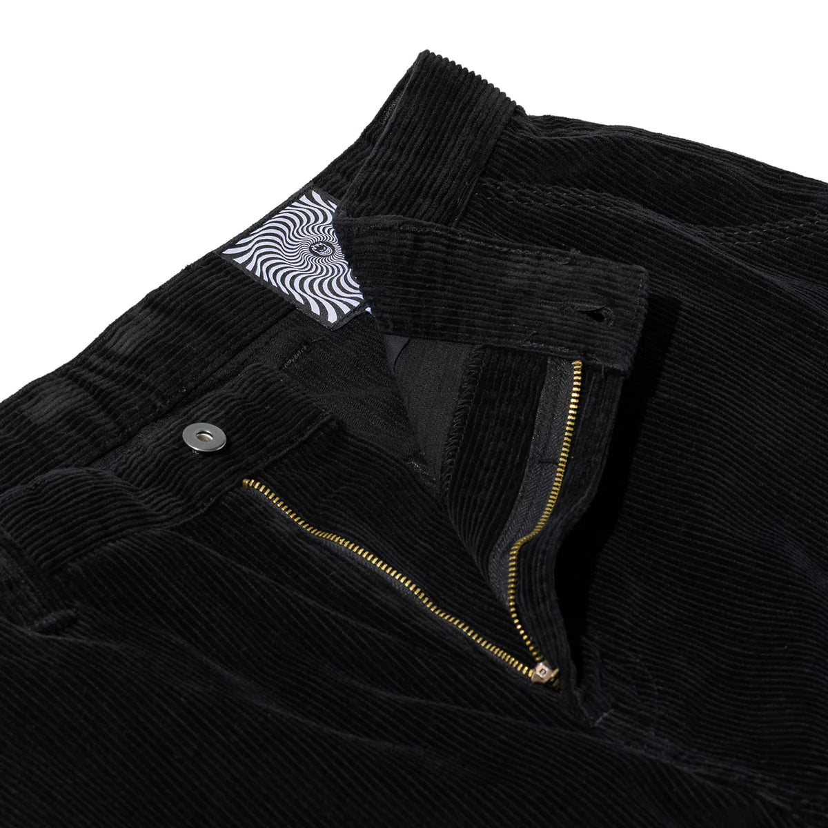 Close-up of a black corduroy jacket with a zipper and button details on a white background