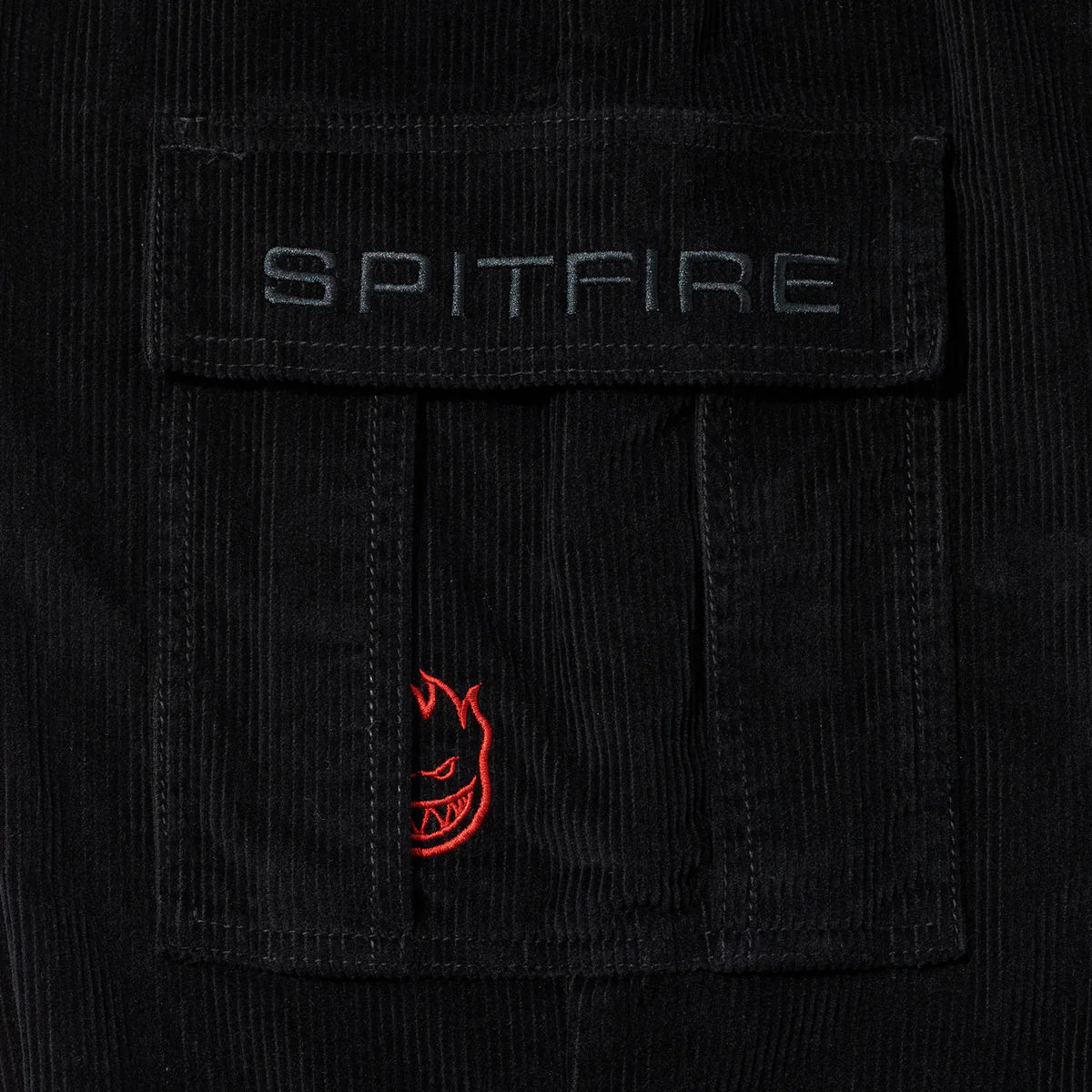 Black corduroy jacket with Spitfire logo on chest pocket