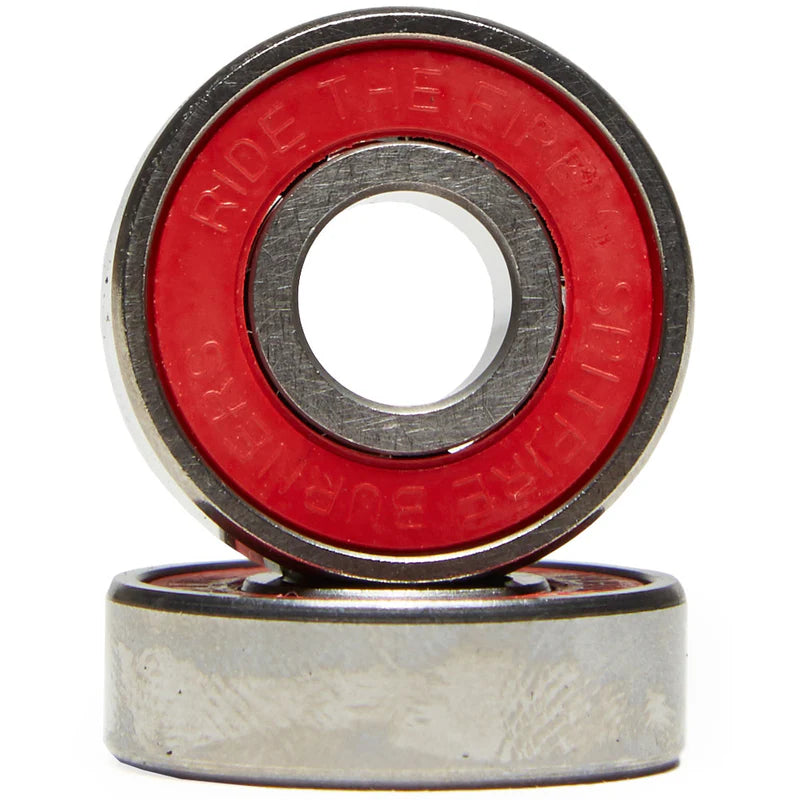 Two skateboard bearings with red outer races on a white background