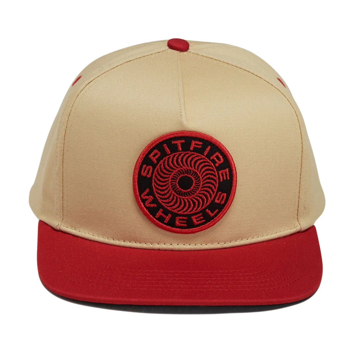 A beige and red snapback cap featuring a circular red and black 'SPITFIRE WHEELS' patch on the front, set against a plain white background.