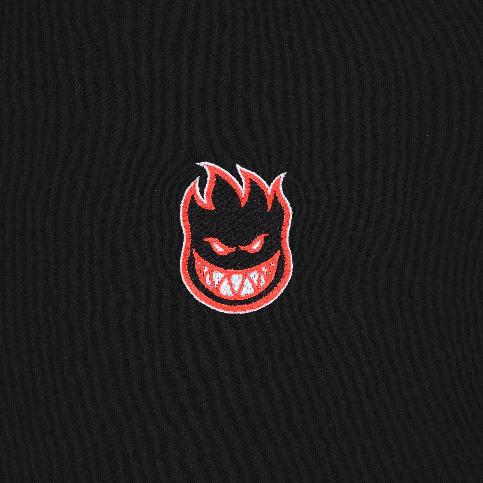 Embroidered logo on a black background