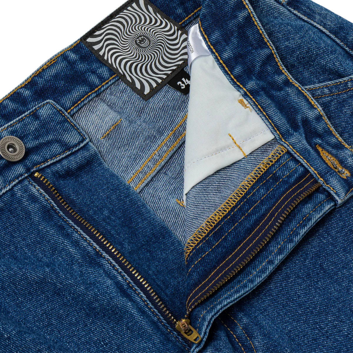 Close-up of blue denim jacket with brand label and white lining