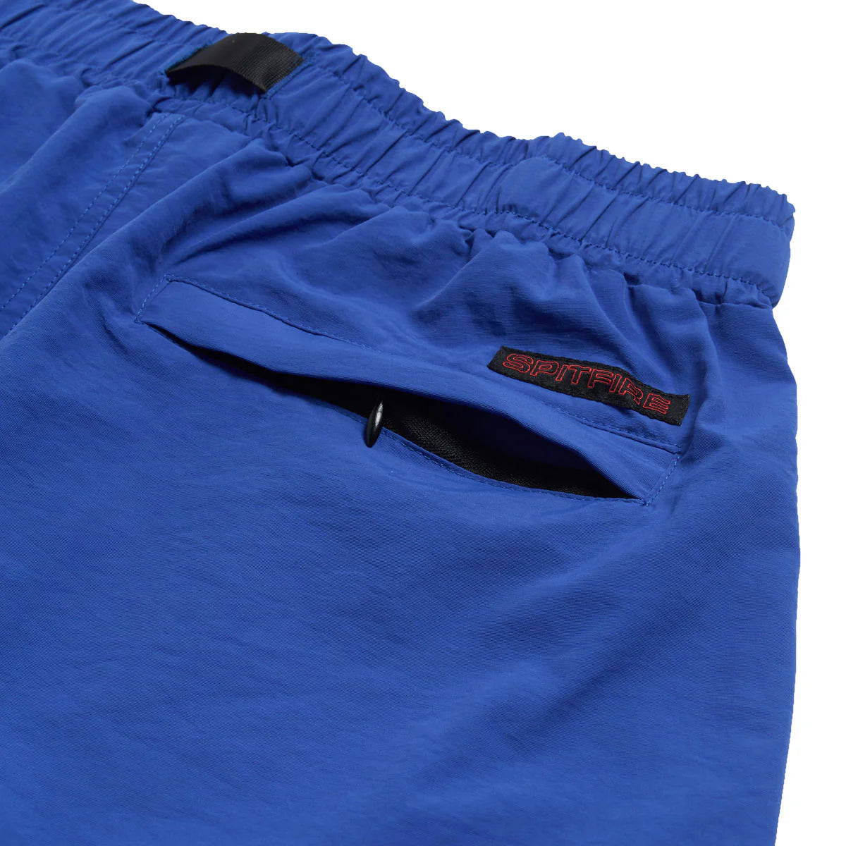 Blue shorts with a brand logo on a white background