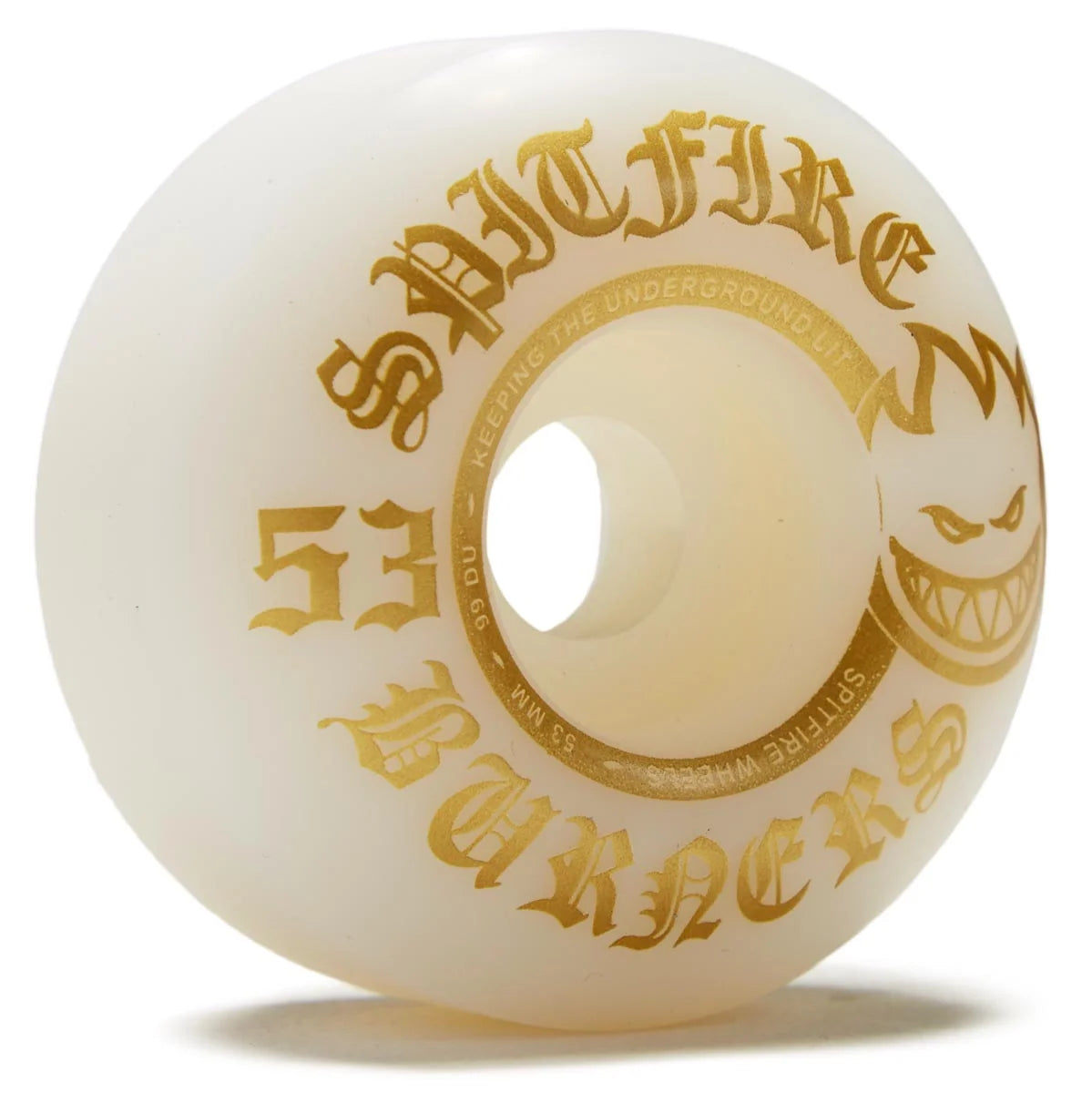An off-white/cream skate wheel with gold gothic lettering that reads 'SPITFIRE ZBURERS' and '53', plus a gold grinning face graphic, on a white background.
