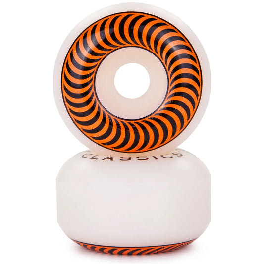 A pair of white skateboard wheels stacked vertically, featuring a prominent orange and black spiral pattern on the inner ring and a matching pattern on the base.