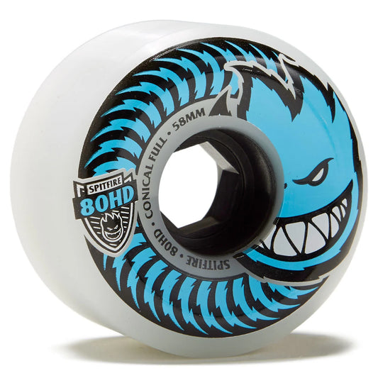 A single skateboard wheel with a translucent white urethane outer barrel, featuring a black and bright blue graphic of a snarling toothy face with the text 'SPITFIRE 80HD CONICAL FULL 58MM'.