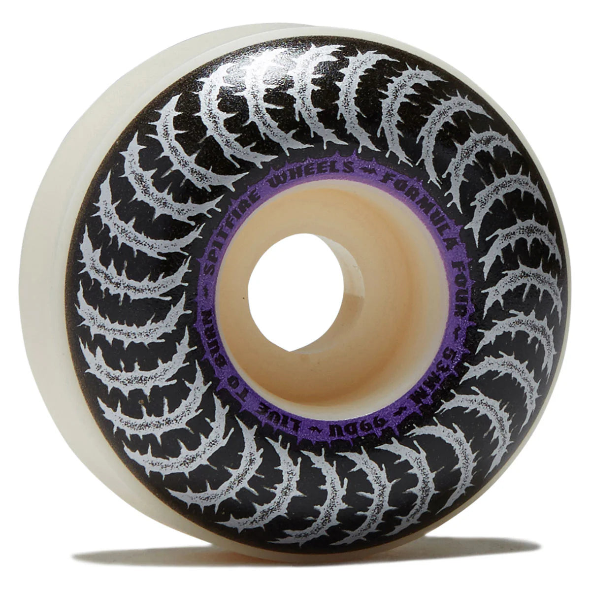 A single skateboard wheel shown on a white background, featuring a black outer barrel with repeating white tire-tread graphics, a purple inner ring with white text, and a translucent cream-colored core.