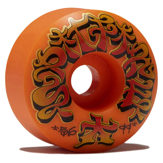 An orange skateboard wheel featuring stylized red and black flame-like graphics and small black text near the bottom, photographed on a white background with a soft shadow.