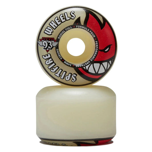 A Spitfire 93 Wheels skateboard wheel shown vertically with its top face facing up, resting on a matching translucent white wheel. The top face features a beige background with a red devil face graphic and black text.