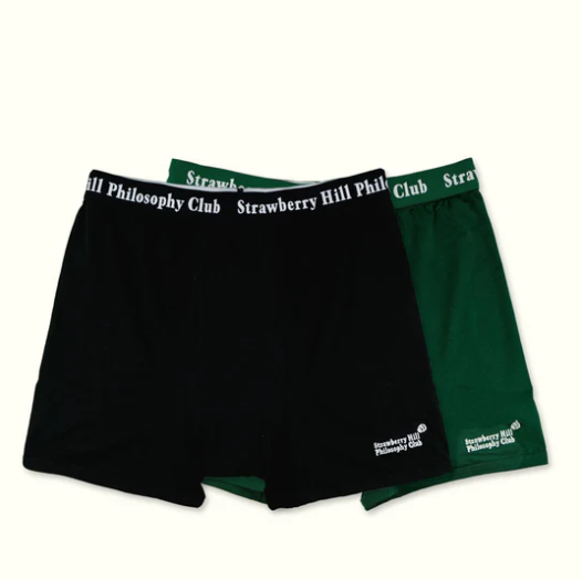 Two pairs of black and green boxer briefs with 'Strawberry Hill Philosophy Club' waistband on a white background.