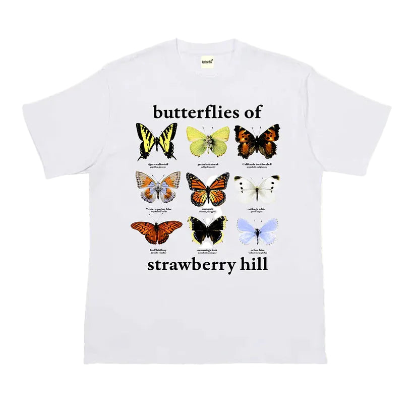 White t-shirt with butterfly illustrations and text on a white background