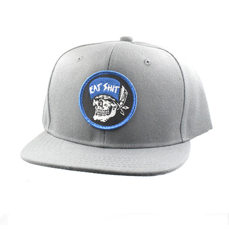 Gray cap with a circular patch featuring a skull and text on a white background