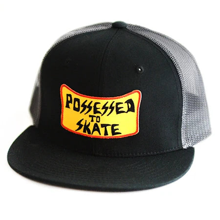 Black cap with yellow and red 'Possessed to Skate' logo on a white background