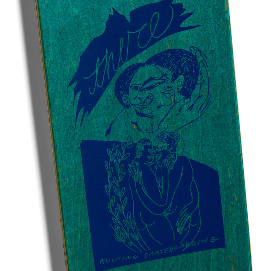 Skateboard deck with blue graphic design on a green background