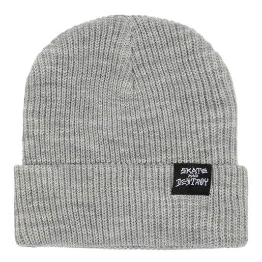 Gray knit beanie with a logo tag on a light gray background