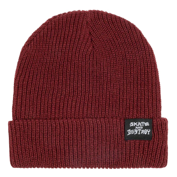 Maroon beanie with a label on a light gray background