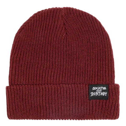 Maroon beanie with a label on a light gray background