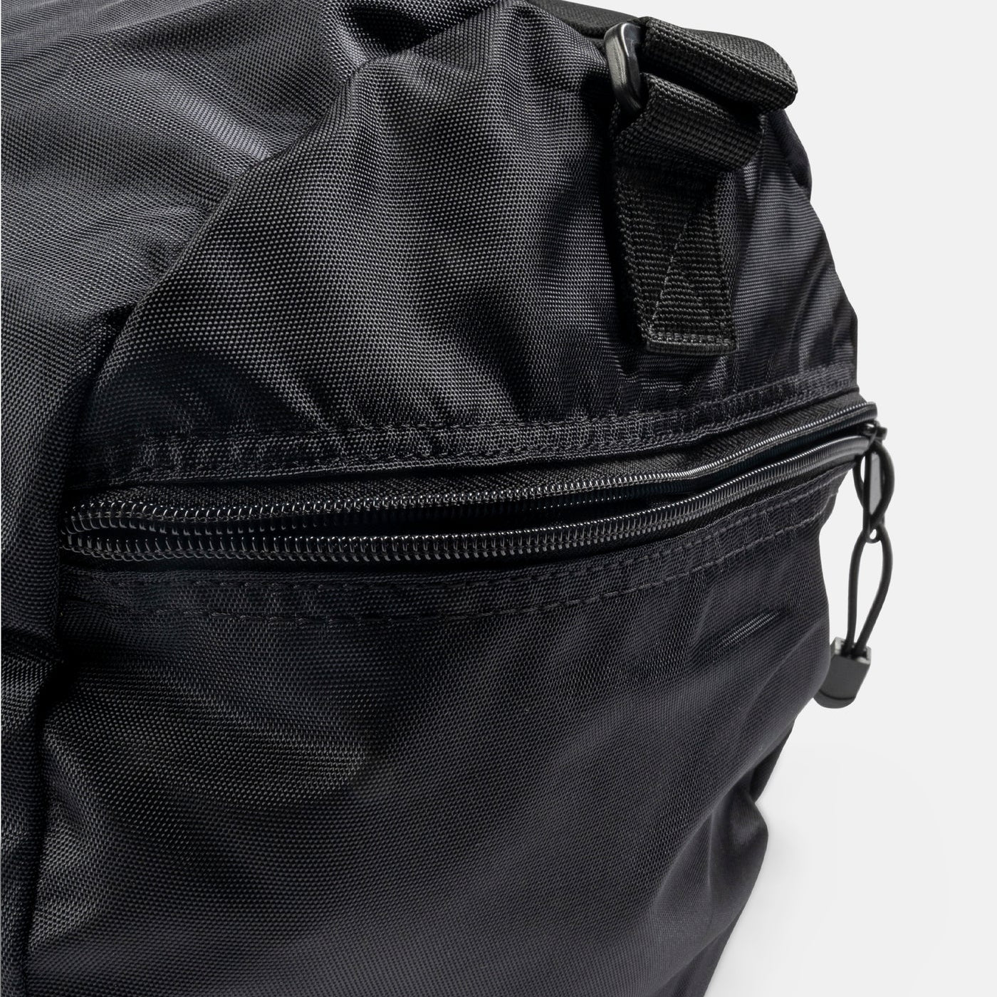 Black duffle bag with a zipper on a white background