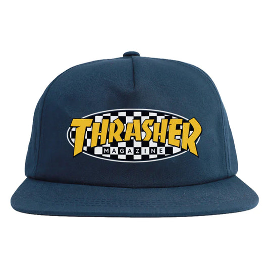 Navy blue cap with yellow and white 'Thrasher Magazine' logo on a white background