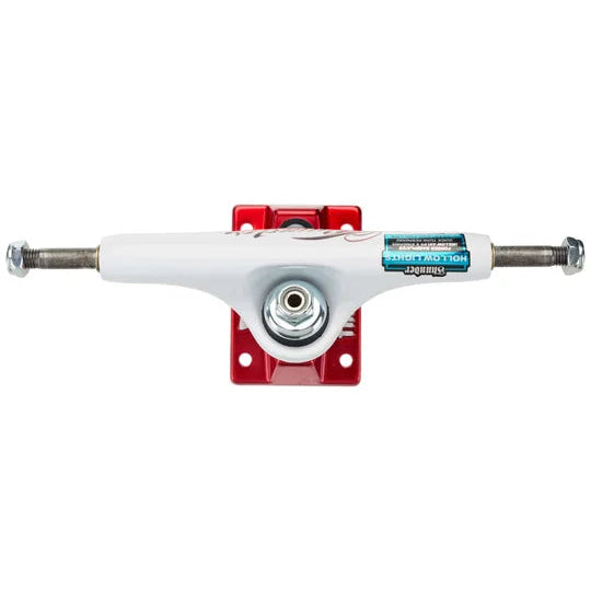 Skateboard truck with red hardware on a white background