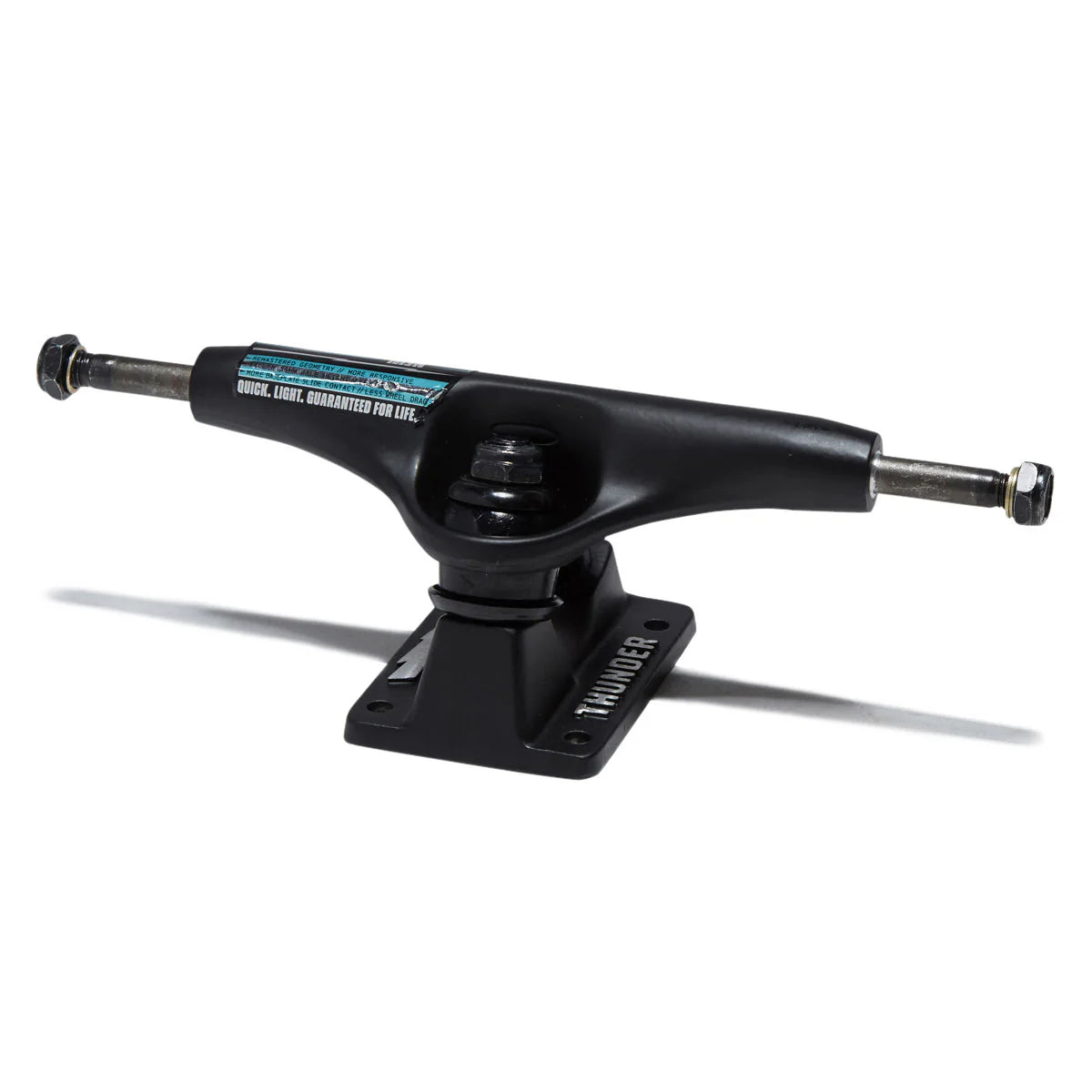 A black skateboard truck with a black baseplate, featuring a blue and white sticker on the side and the brand name 'Thunder' printed on the baseplate, set against a plain white background.